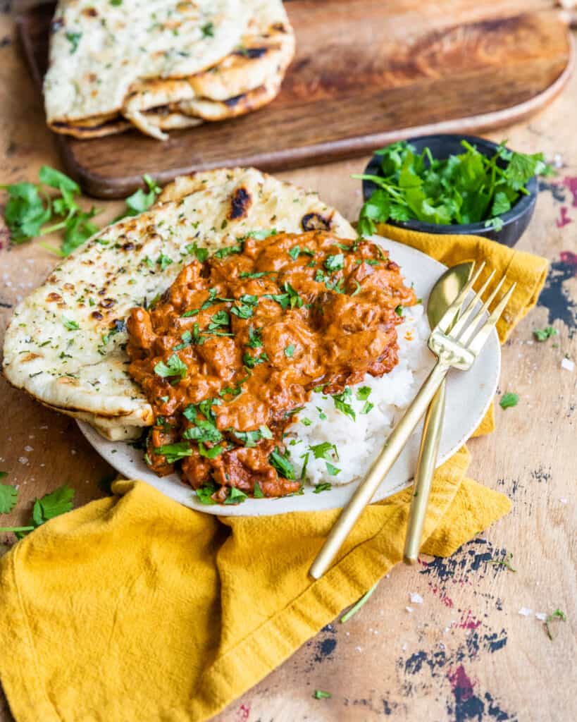 better than takeout butter chicken garnished with cilantro