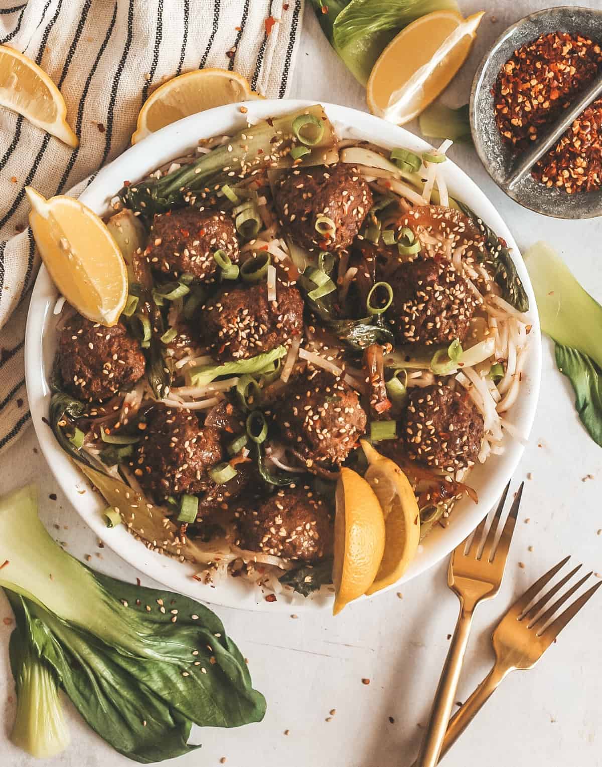 slow cooker swedish meatballs with rice noodles in a bowl.