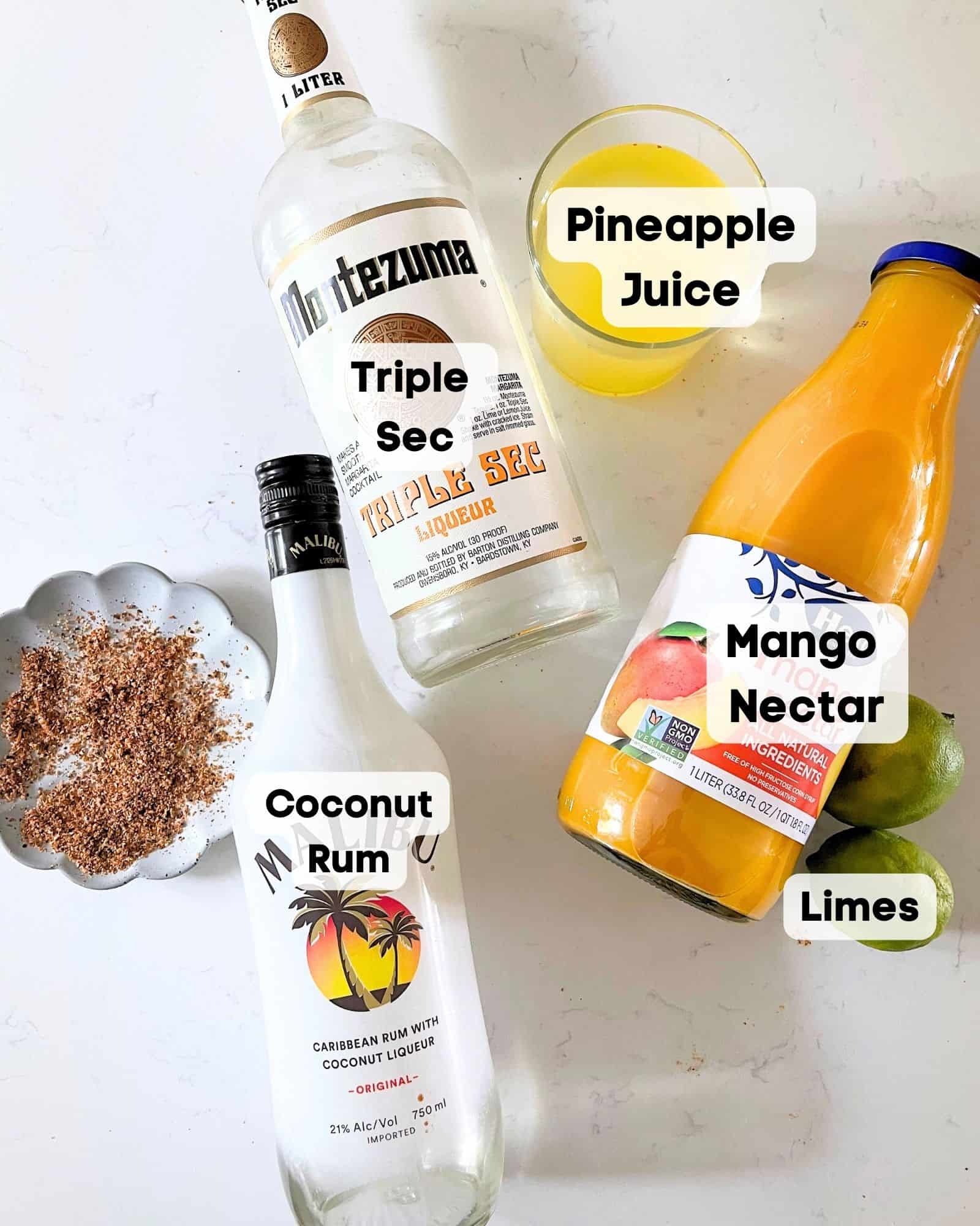 ingredients to make a mango tango - mango nectar, triple sec, coconut rum, pineapple juice, and lime juice.
