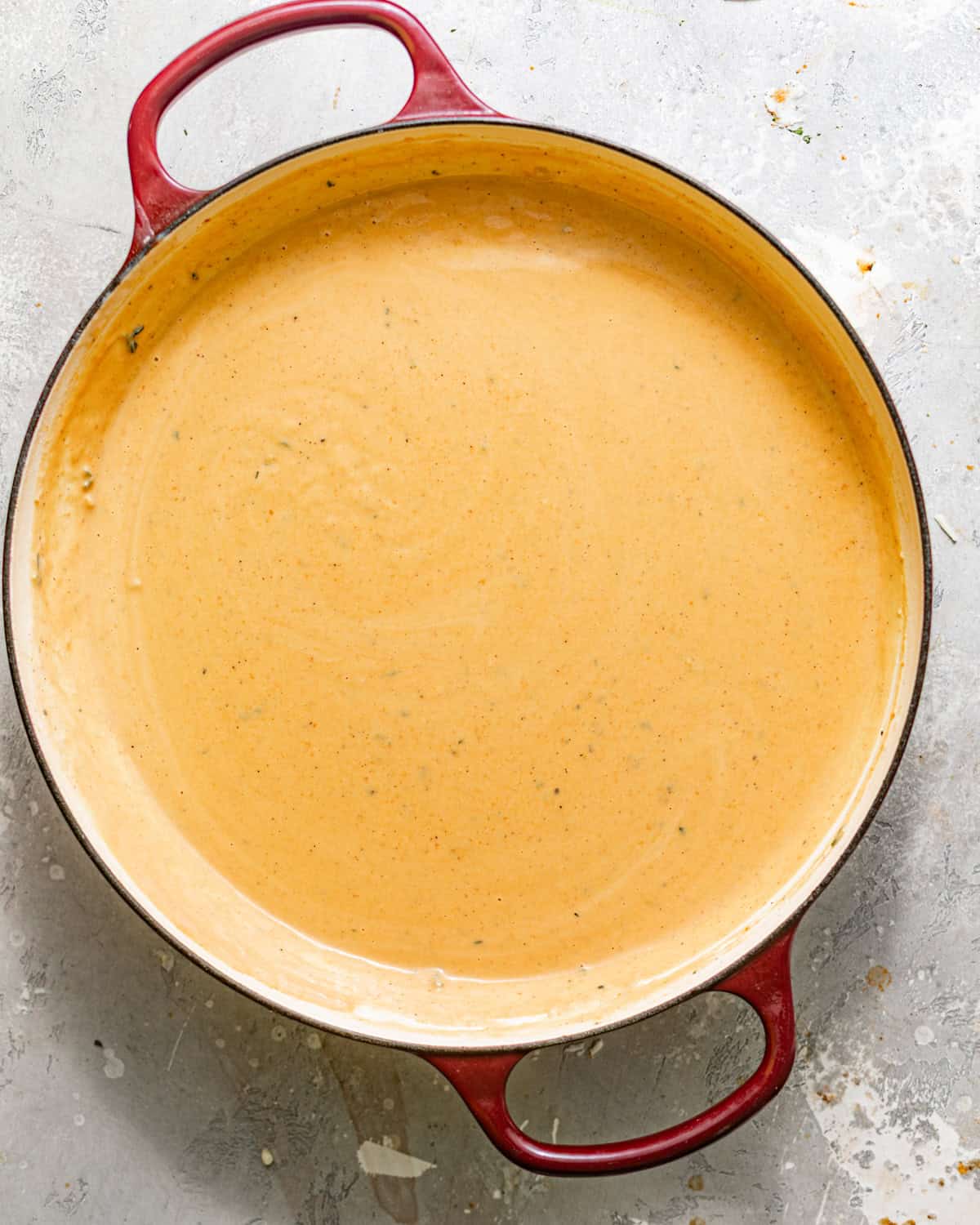 pumpkin bechamel sauce mixed together in a pan. 