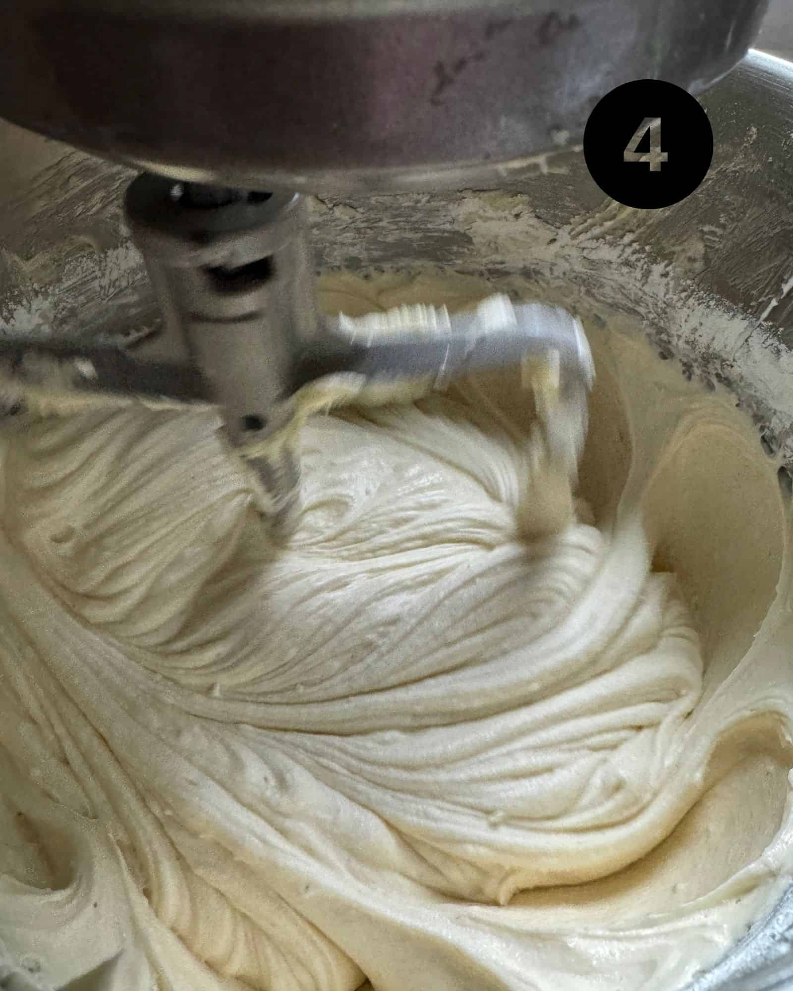 butter and shortening in a stand mixer being creamed together.