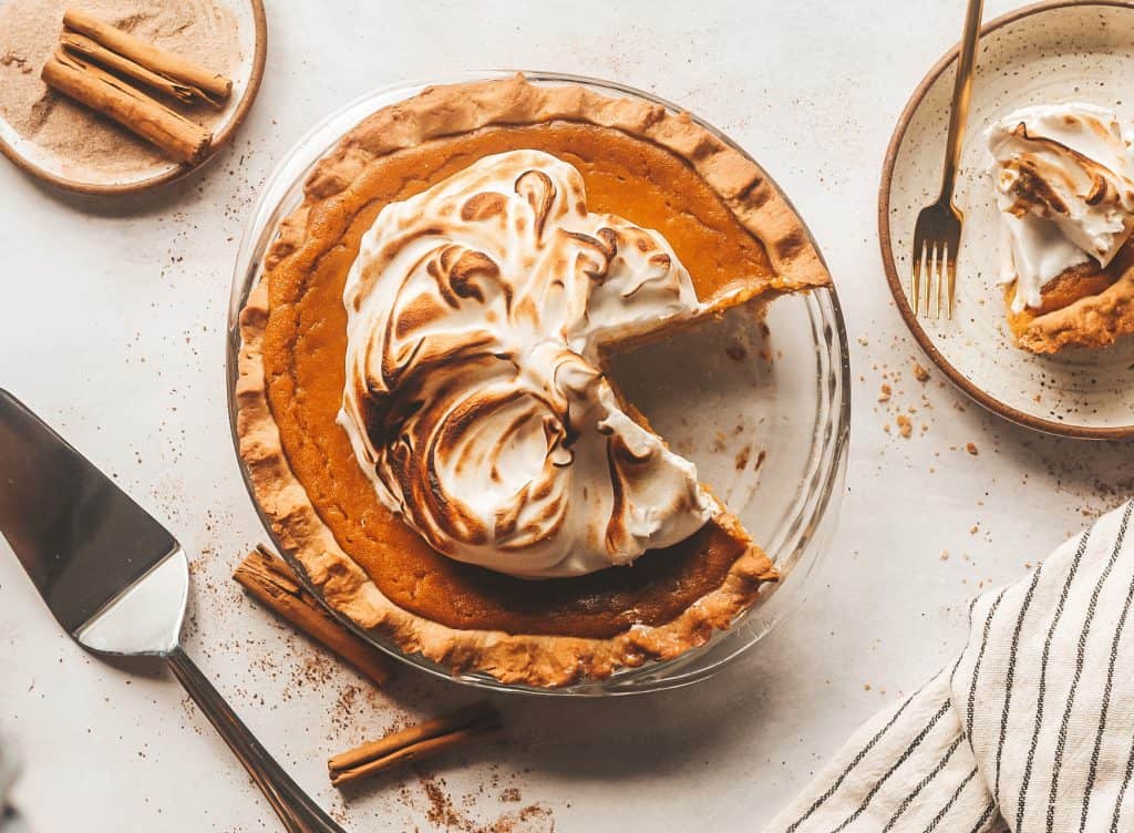 overheat photo pumpkin pie with a slice cut out of it