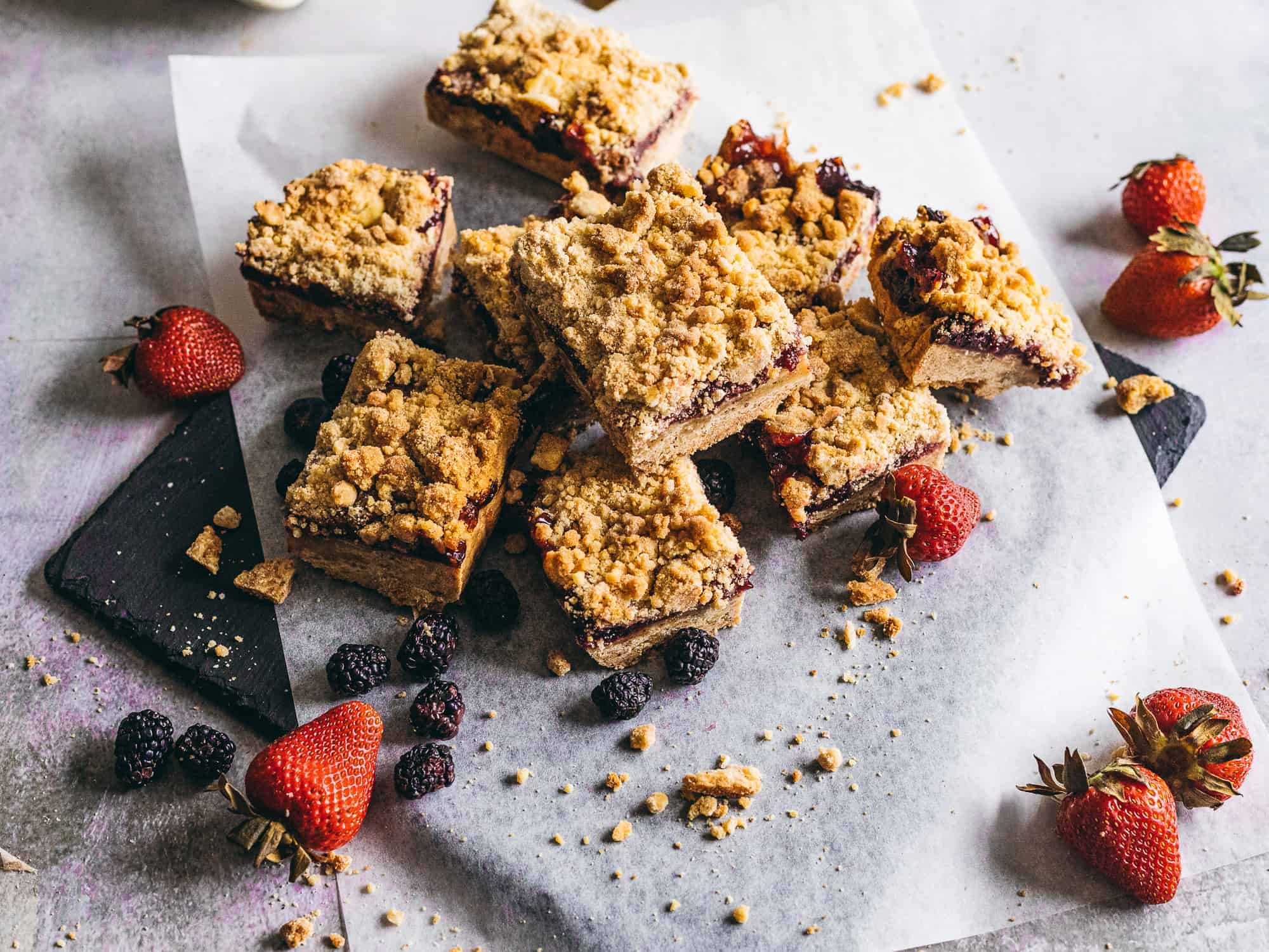 mixed Berry Crumble Bars stacked on top of each other