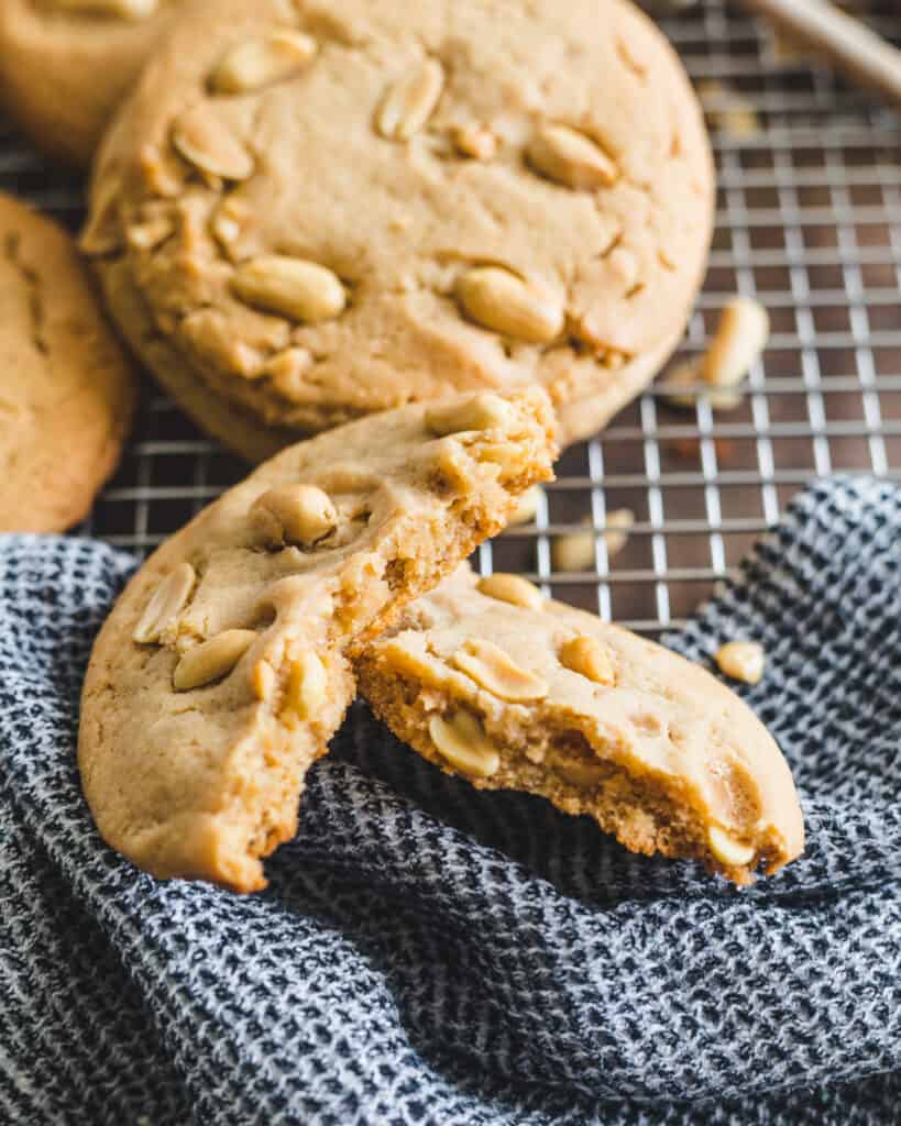 Honey Peanut Butter Cookies on a cooling rack with a cloth