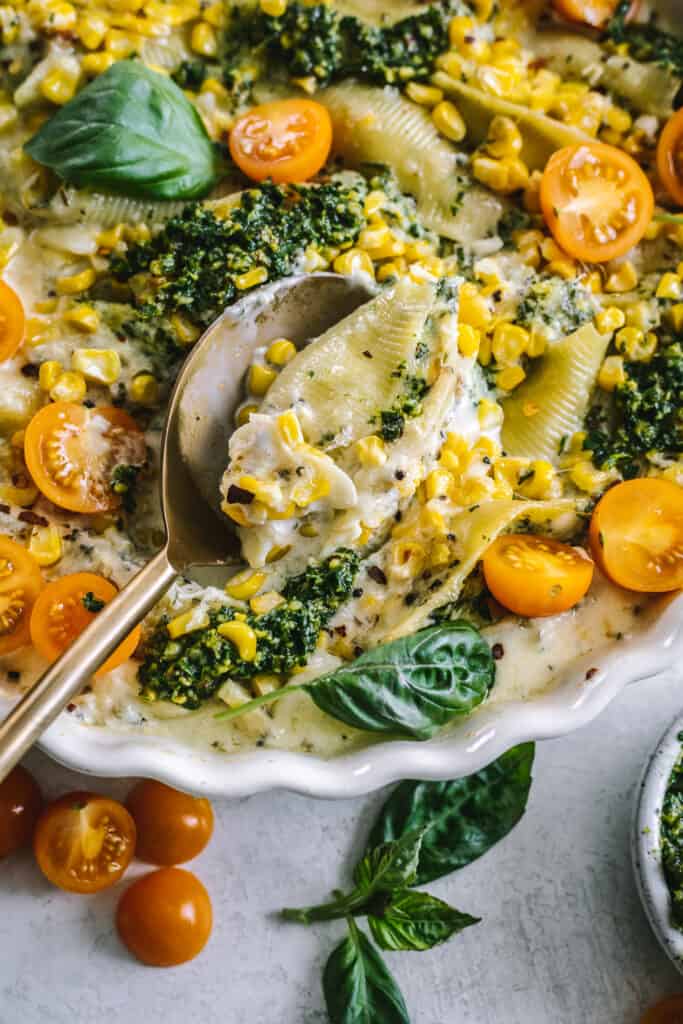 Kale Pesto and Cheese Stuffed Shells in a spoon