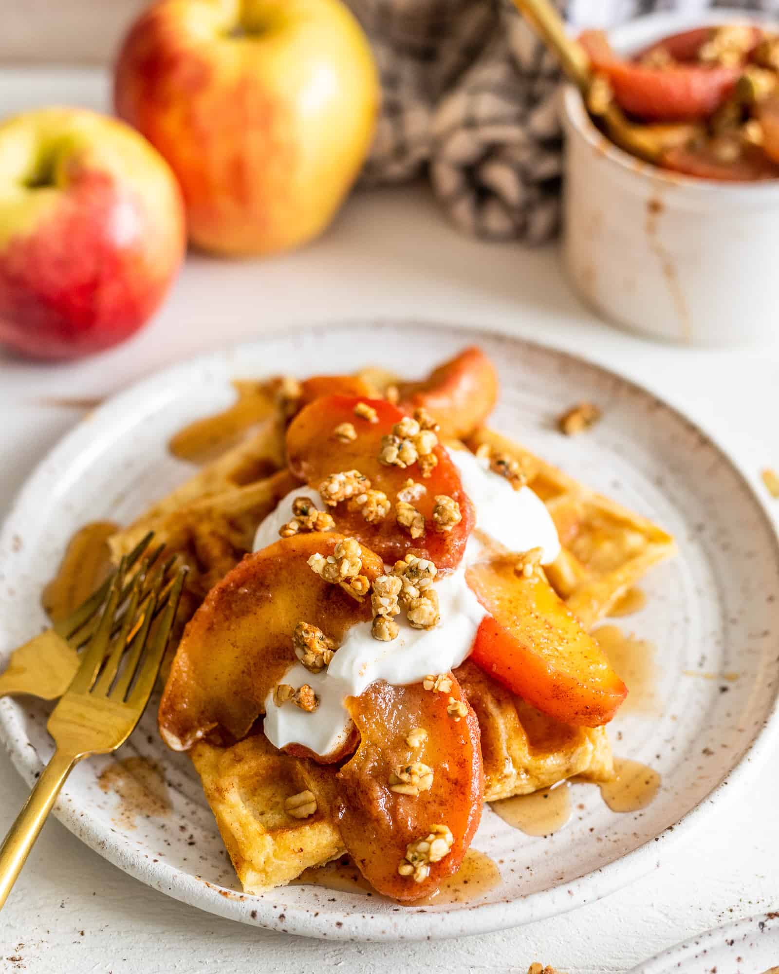 brown butter waffles with cinnamon apples on a plate