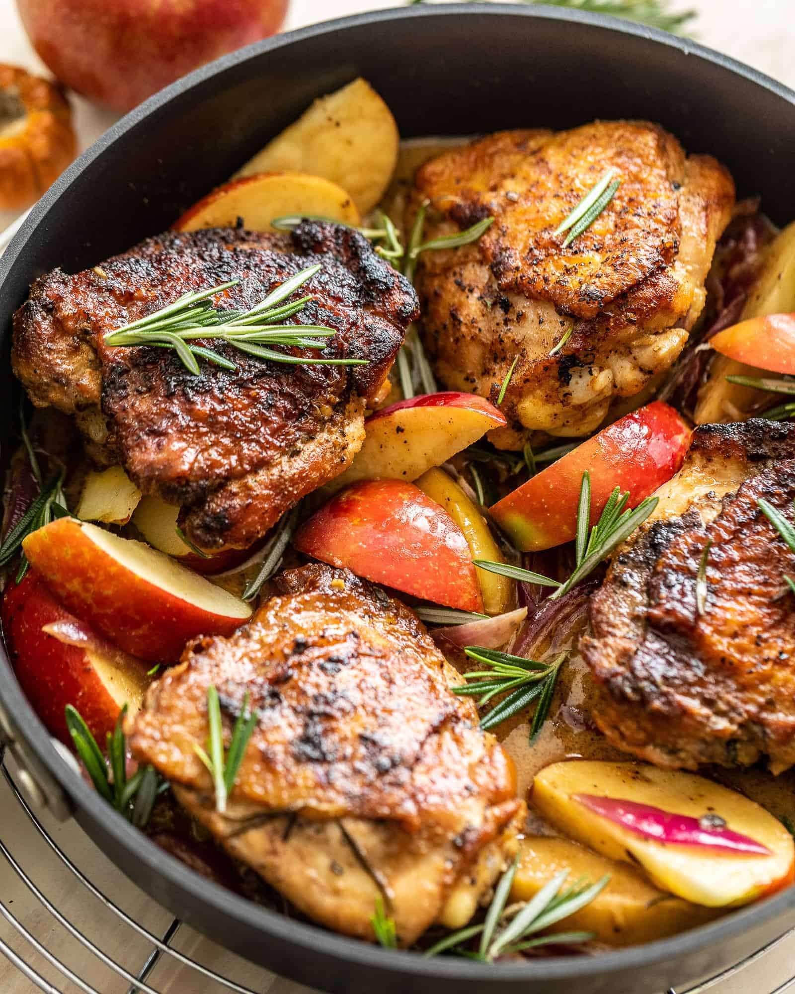 rosemary apple cider chicken in a pan