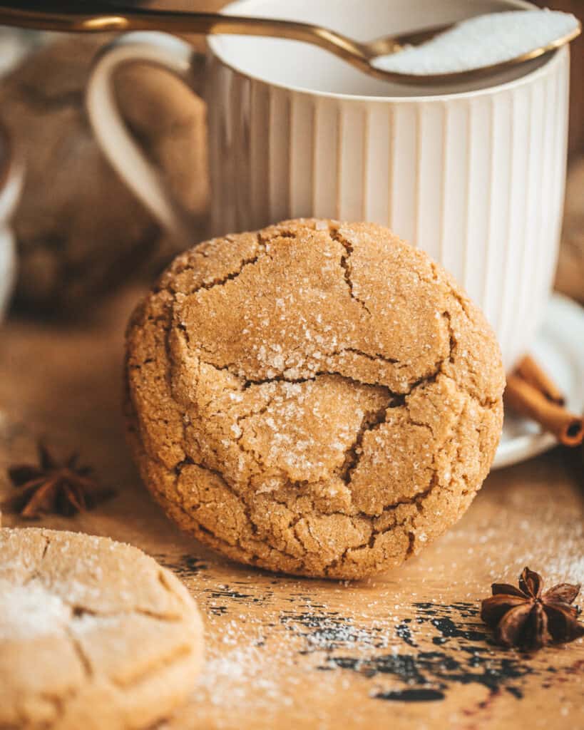 a brown butter chai Cookie in front of a tea cup