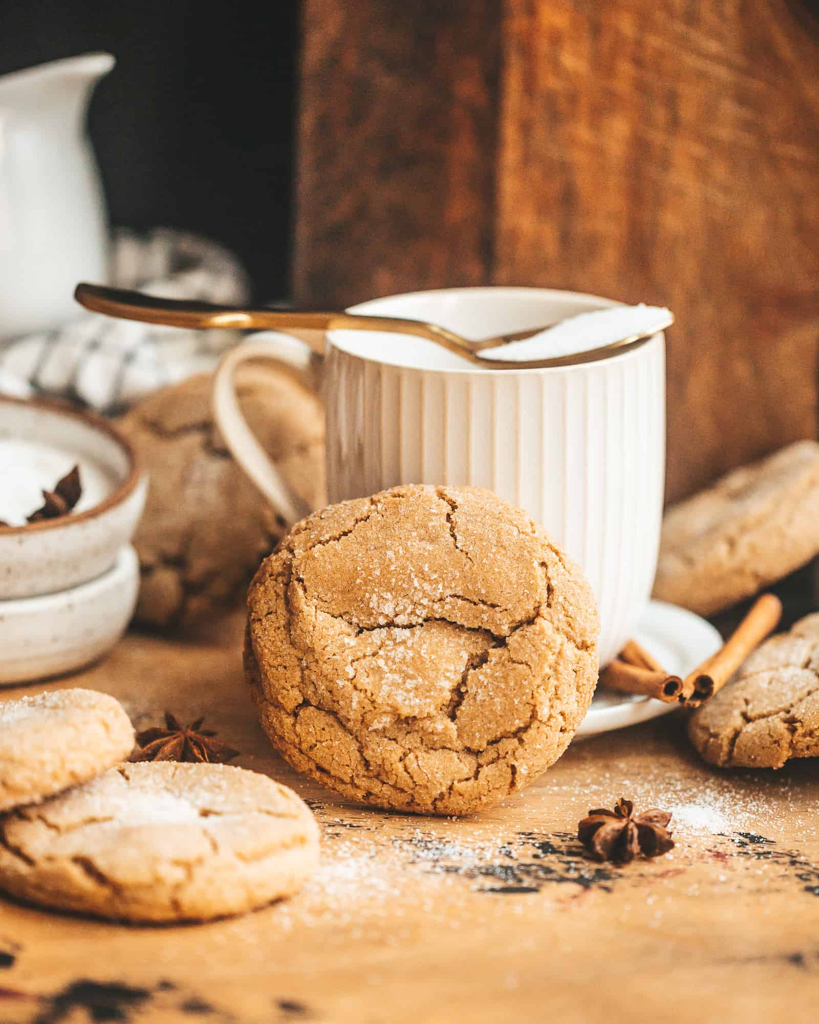 Brown Butter Chai Cookie in front of a tea cup