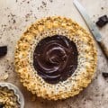 salted caramel chocolate tart with on a table