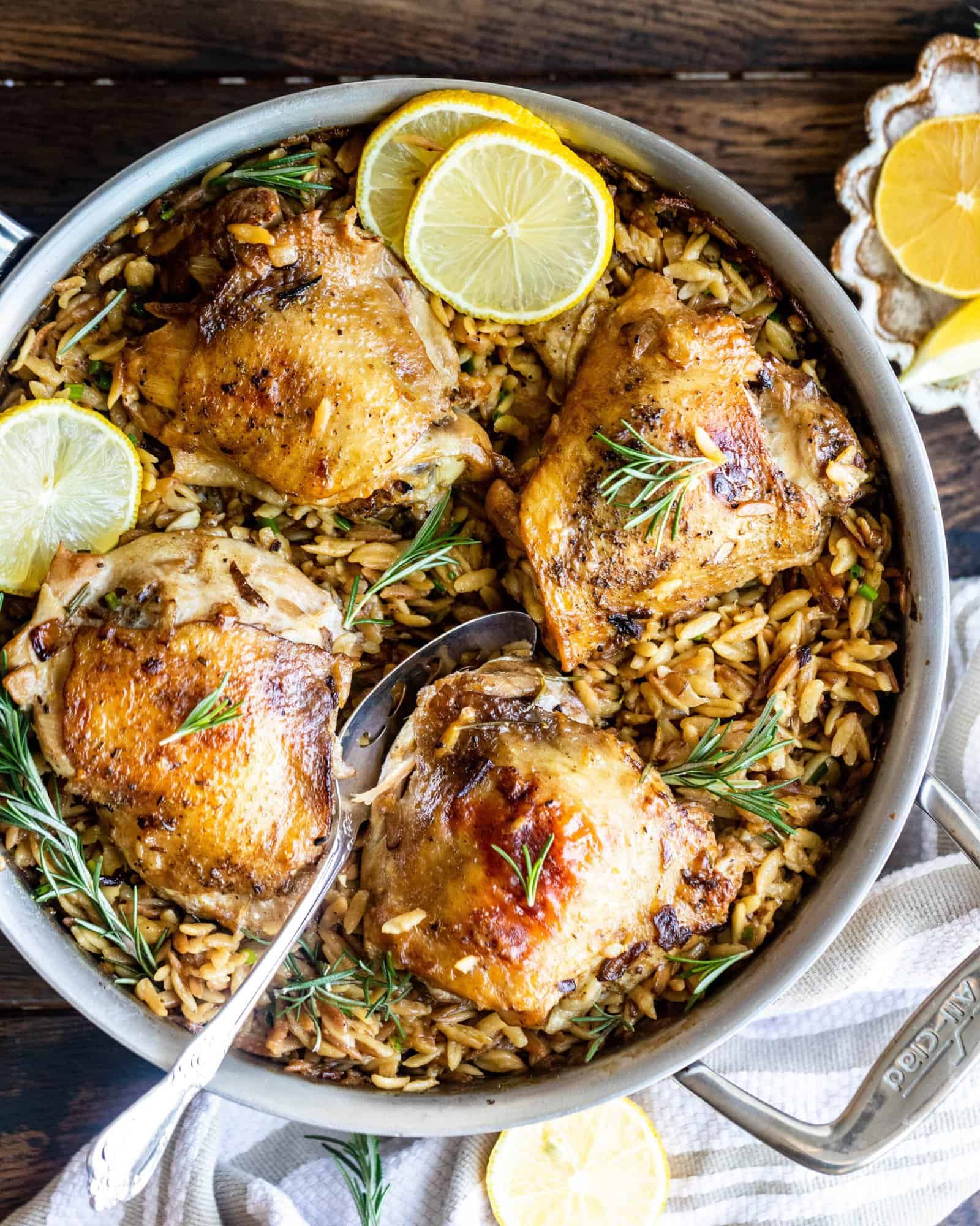 rosemary chicken with parmesan orzo in a pan