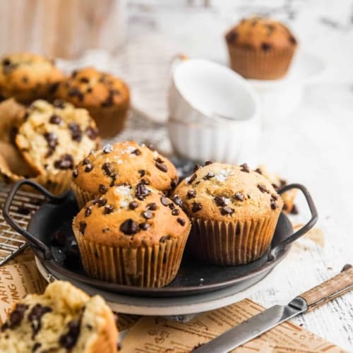 Bakery style chocolate chip muffins on a serving tray