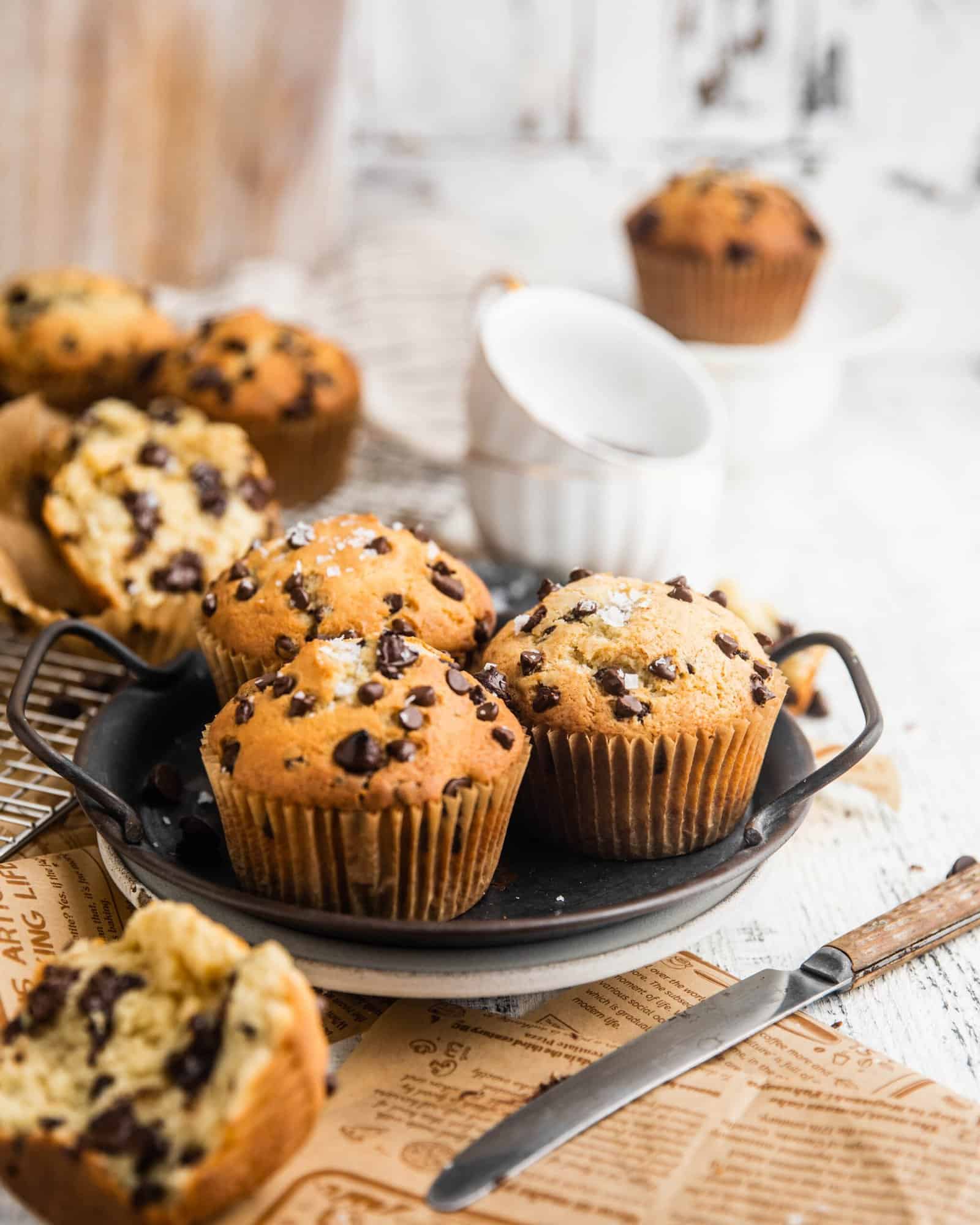 Bakery style chocolate chip muffins on a serving tray