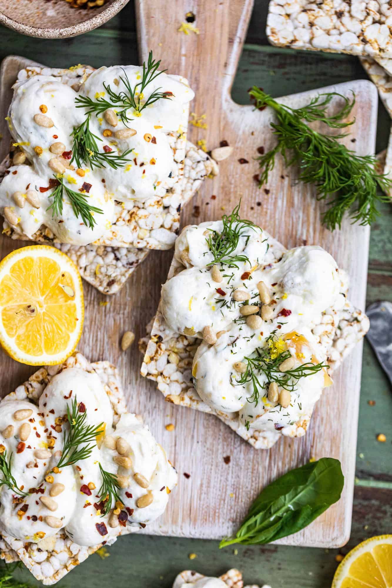 Roasted Garlic Labneh on a serving board with crackers