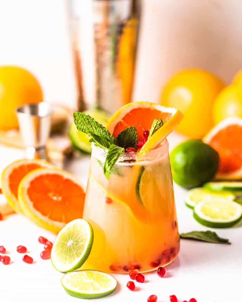 grapefruit margaritas with lime and grapefruit in a glass