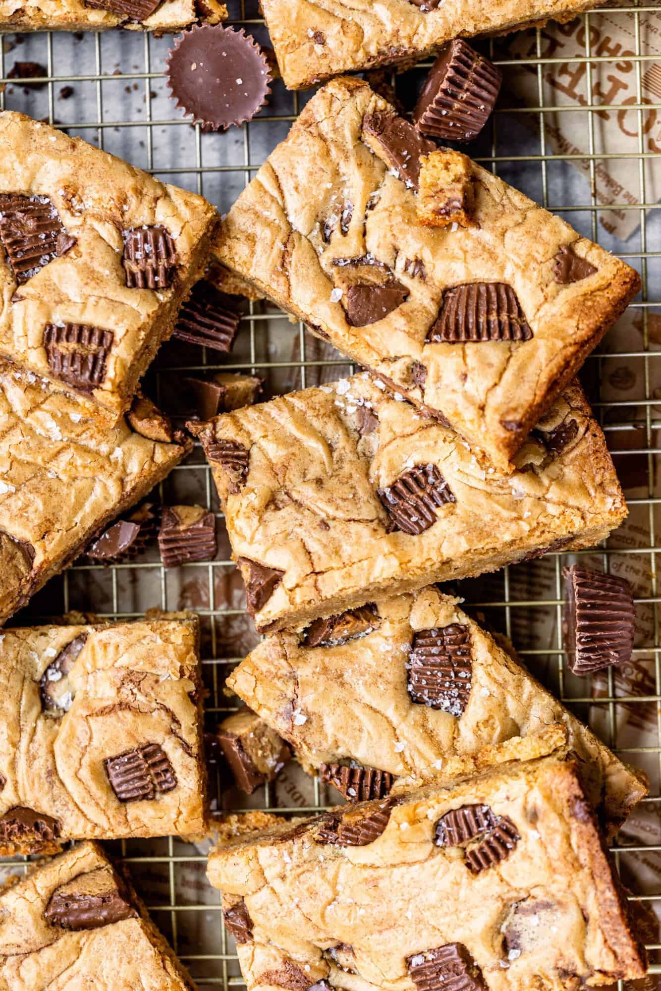 peanut butter cup blondies cup into squares on a cooling rack