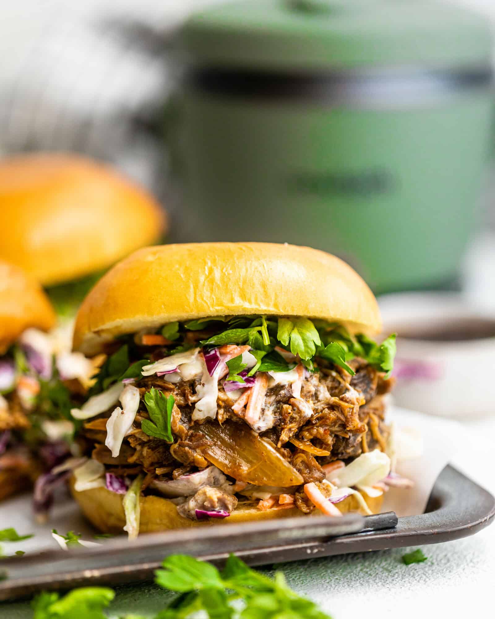 bbq pulled pork sandwich on a white surface