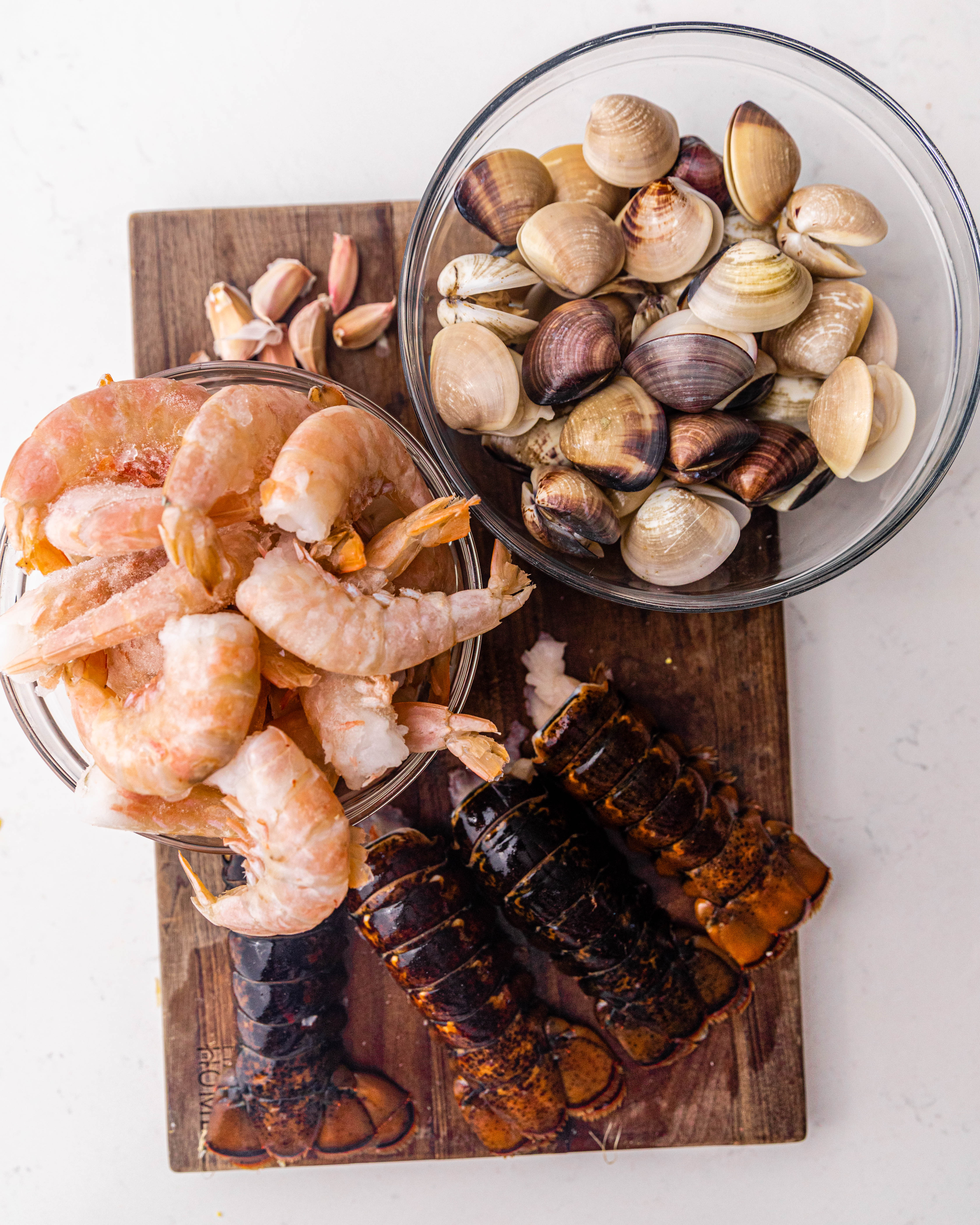 lobster, shrimp, and mussels on a cutting board