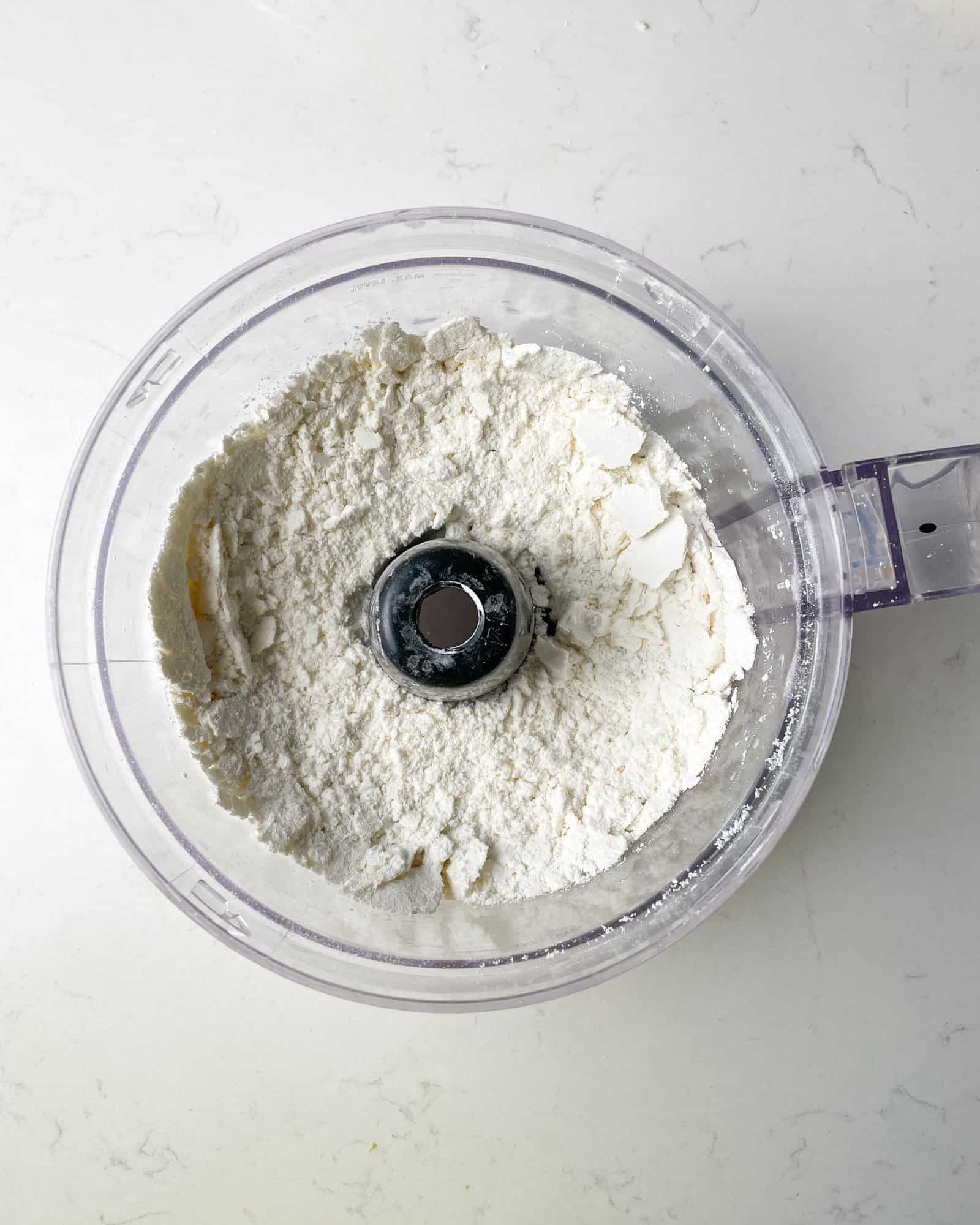 almond flour and powdered sugar in a food processor