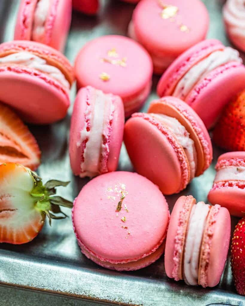 strawberry macarons facing opposite directions