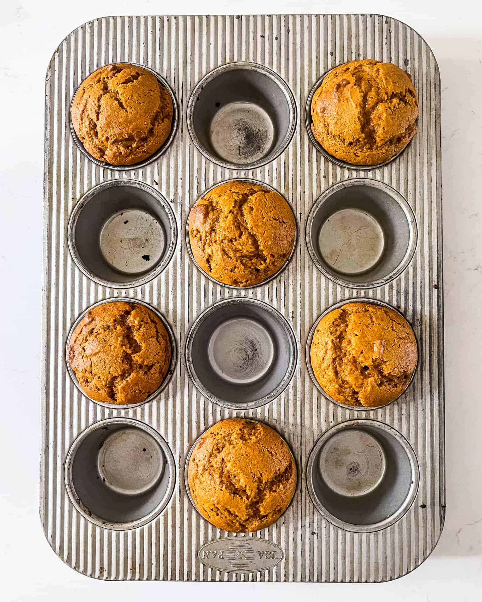 pumpkin muffins baked in a muffin pan