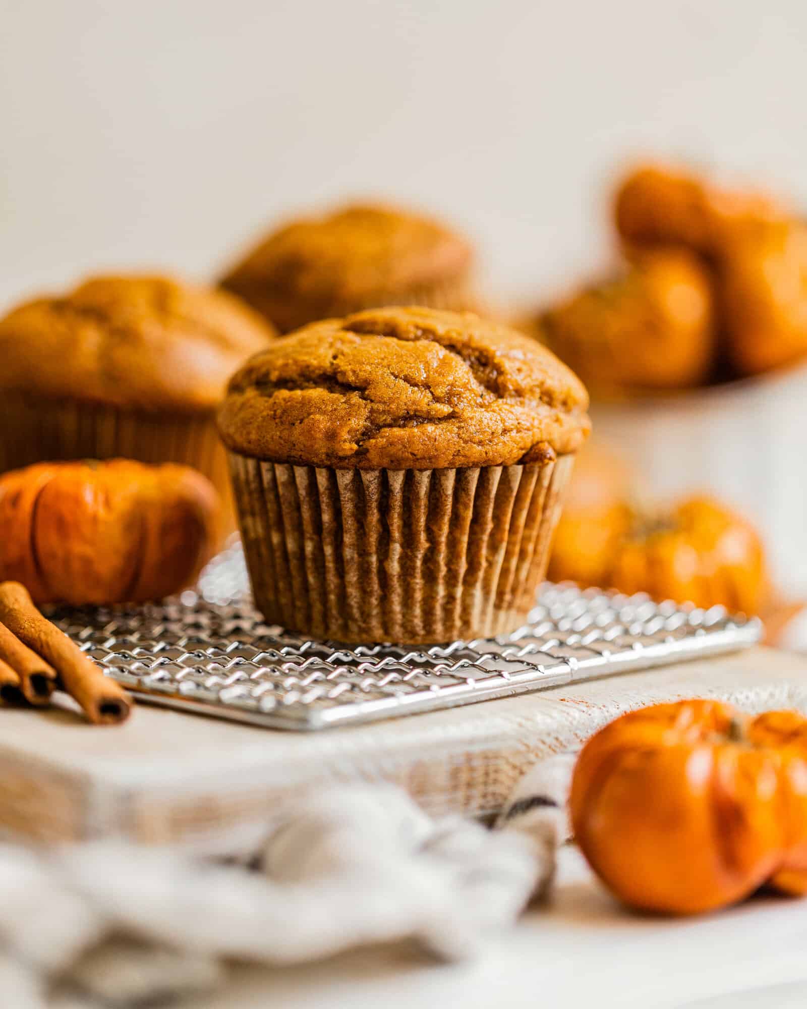 a pumpkin muffin on a white table