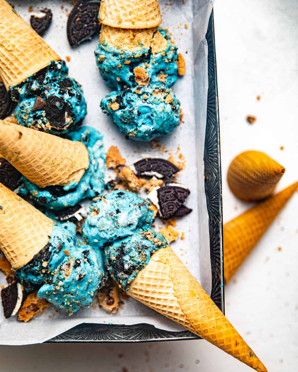 cookie monster ice cream in ice cream cones in a loaf pan.