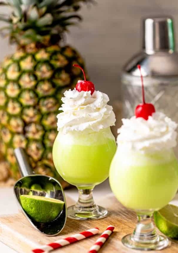 two scooby snack shots in front of a pineapple.