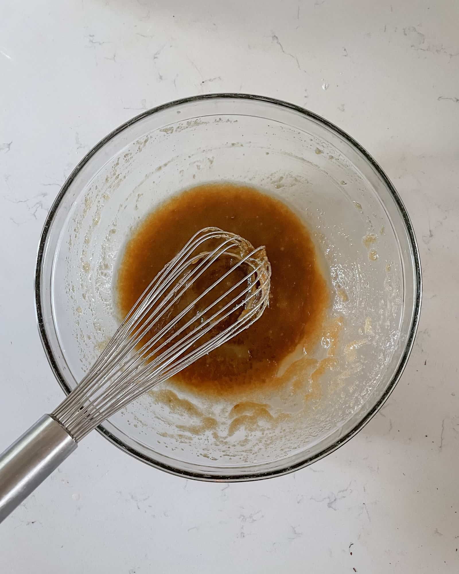 brown sugar, melted butter, and vanilla extract whisked together in a large mixing bowl.