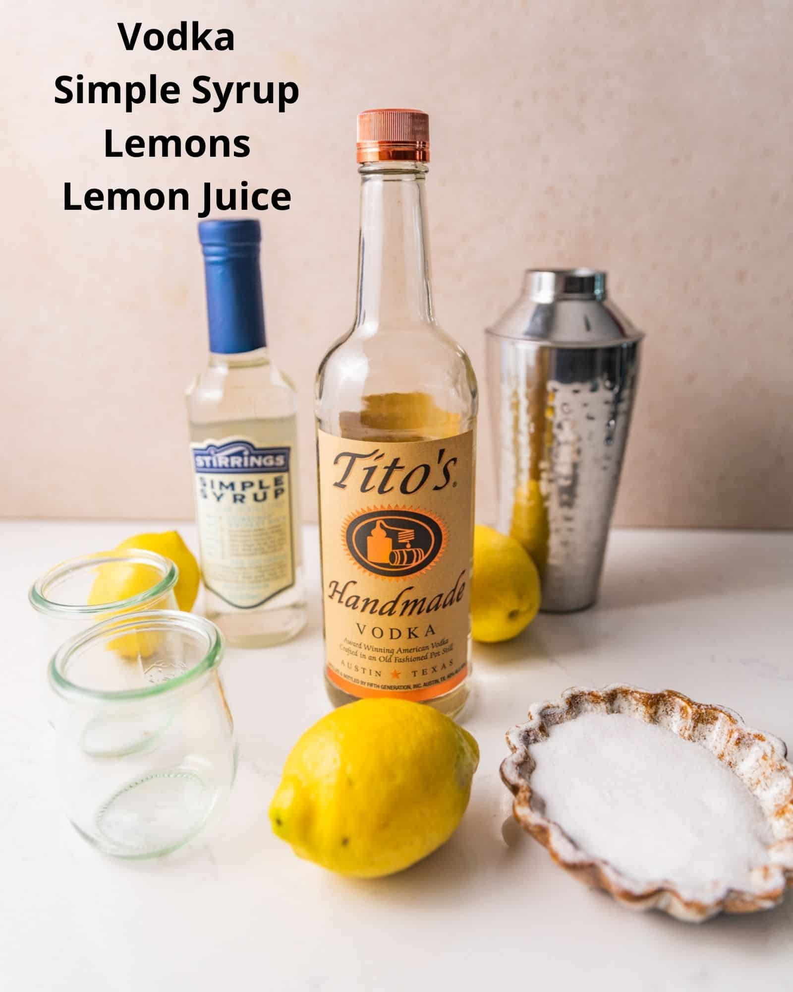 ingredients needed to make a lemon drop shot: vodka, simple syrup, lemons, lemon juice, and sugar.