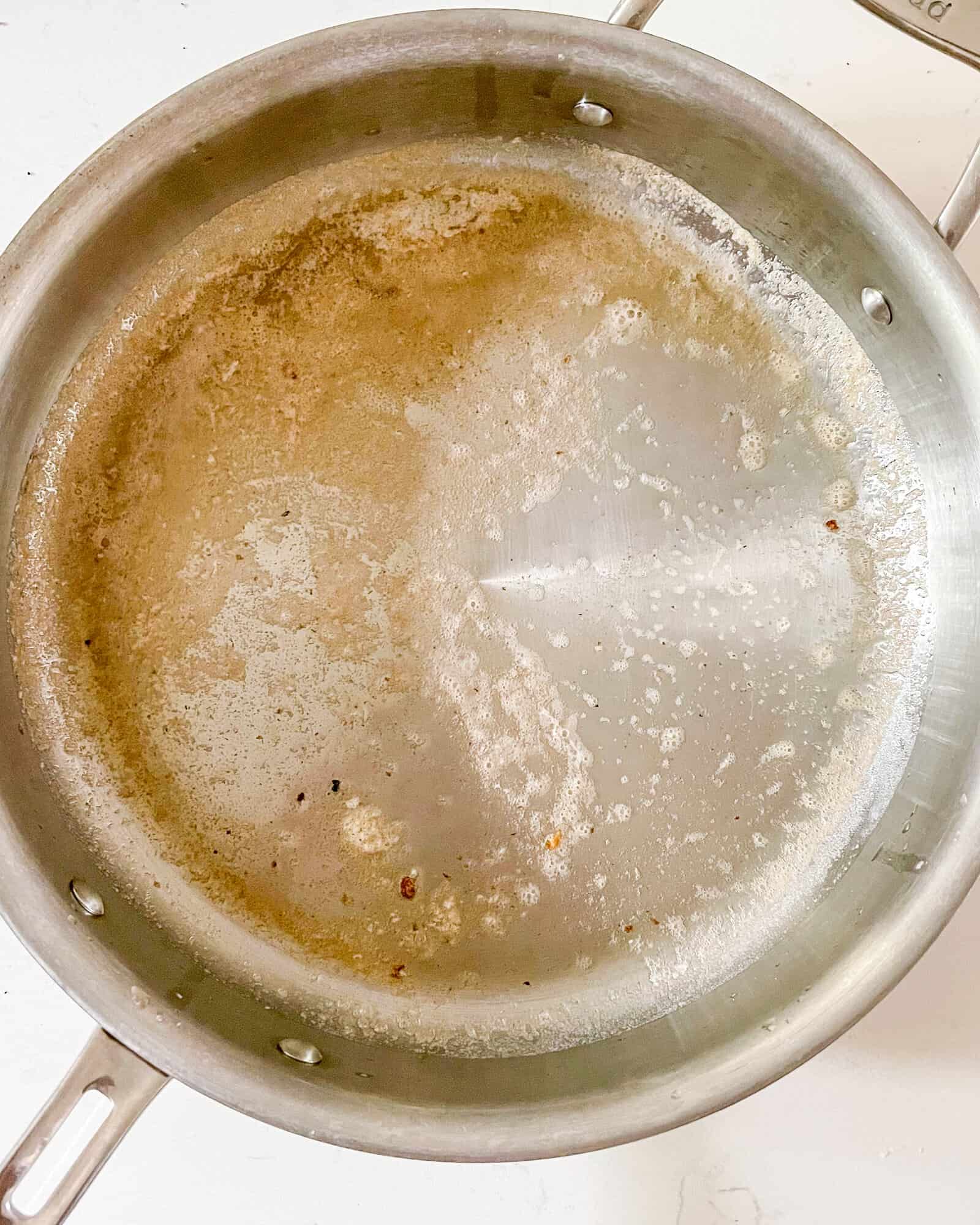 melted butter and olive oil in a frying pan.