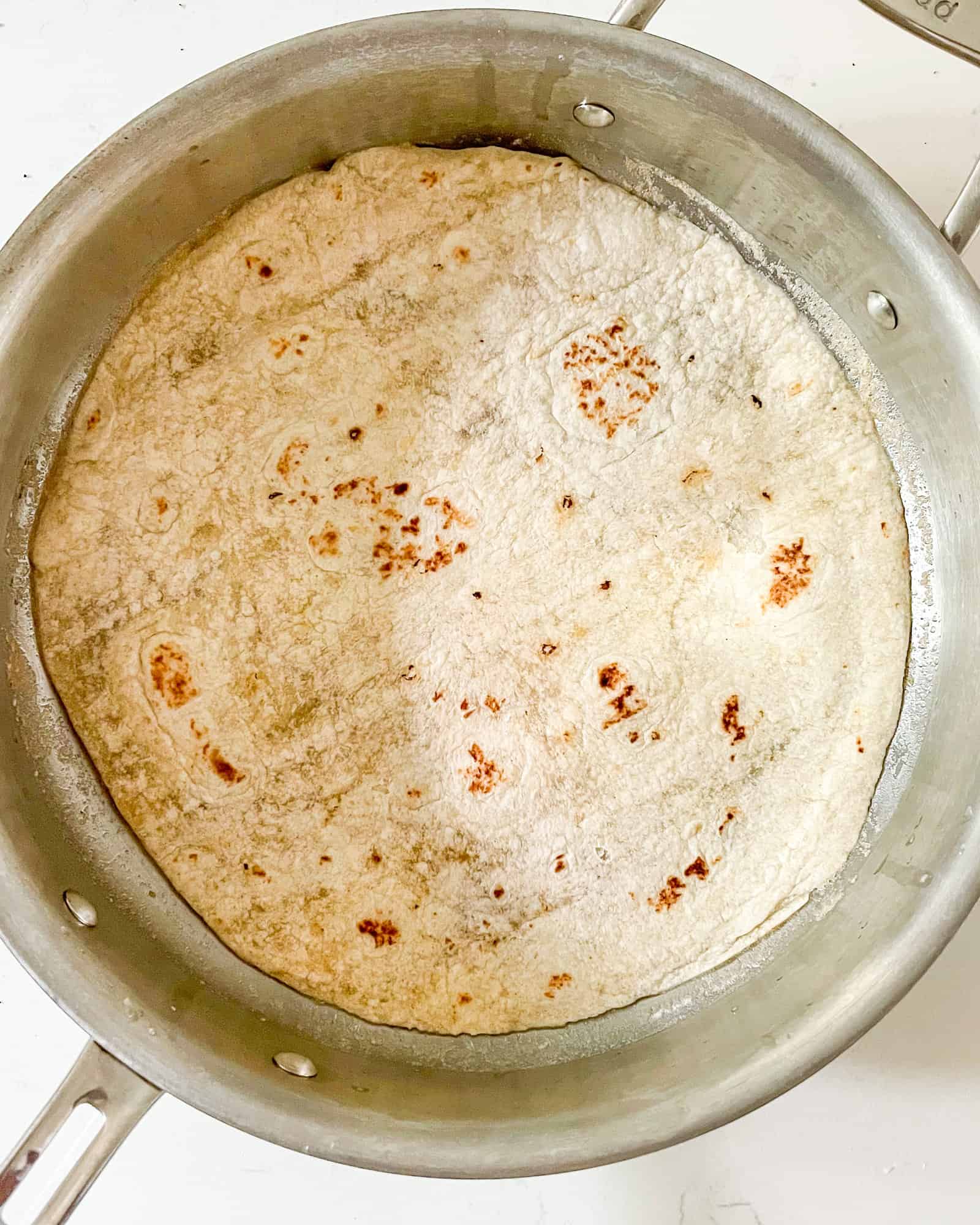 a tortilla in a frying pan.
