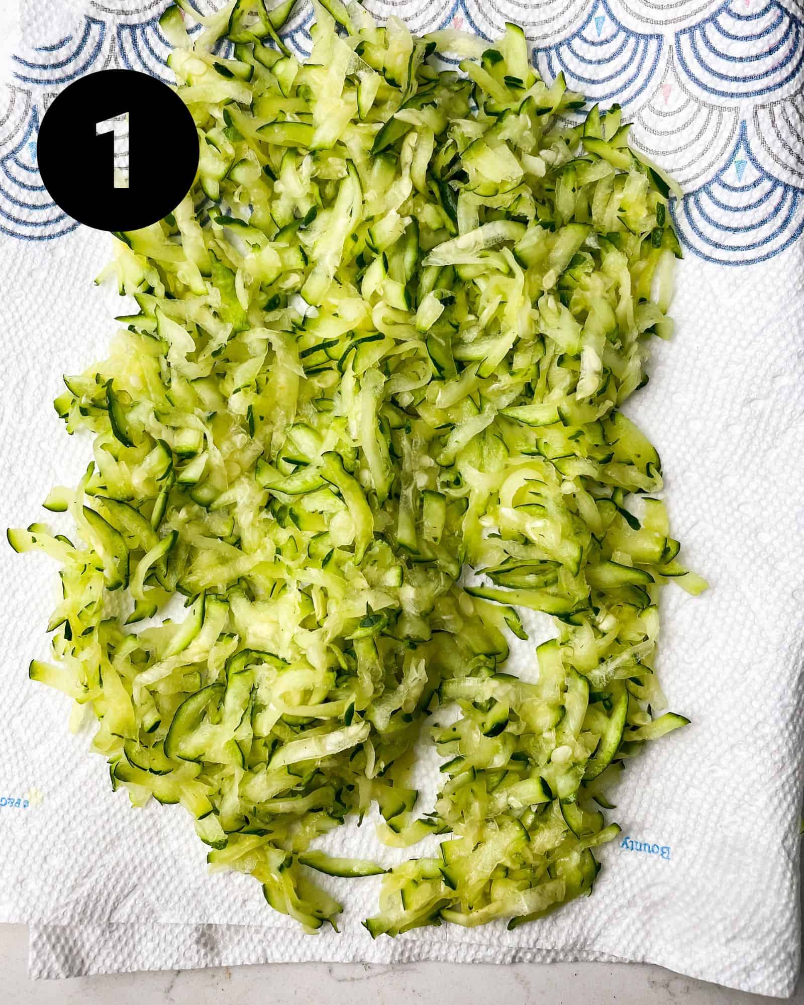 grated zucchini on a paper towel.