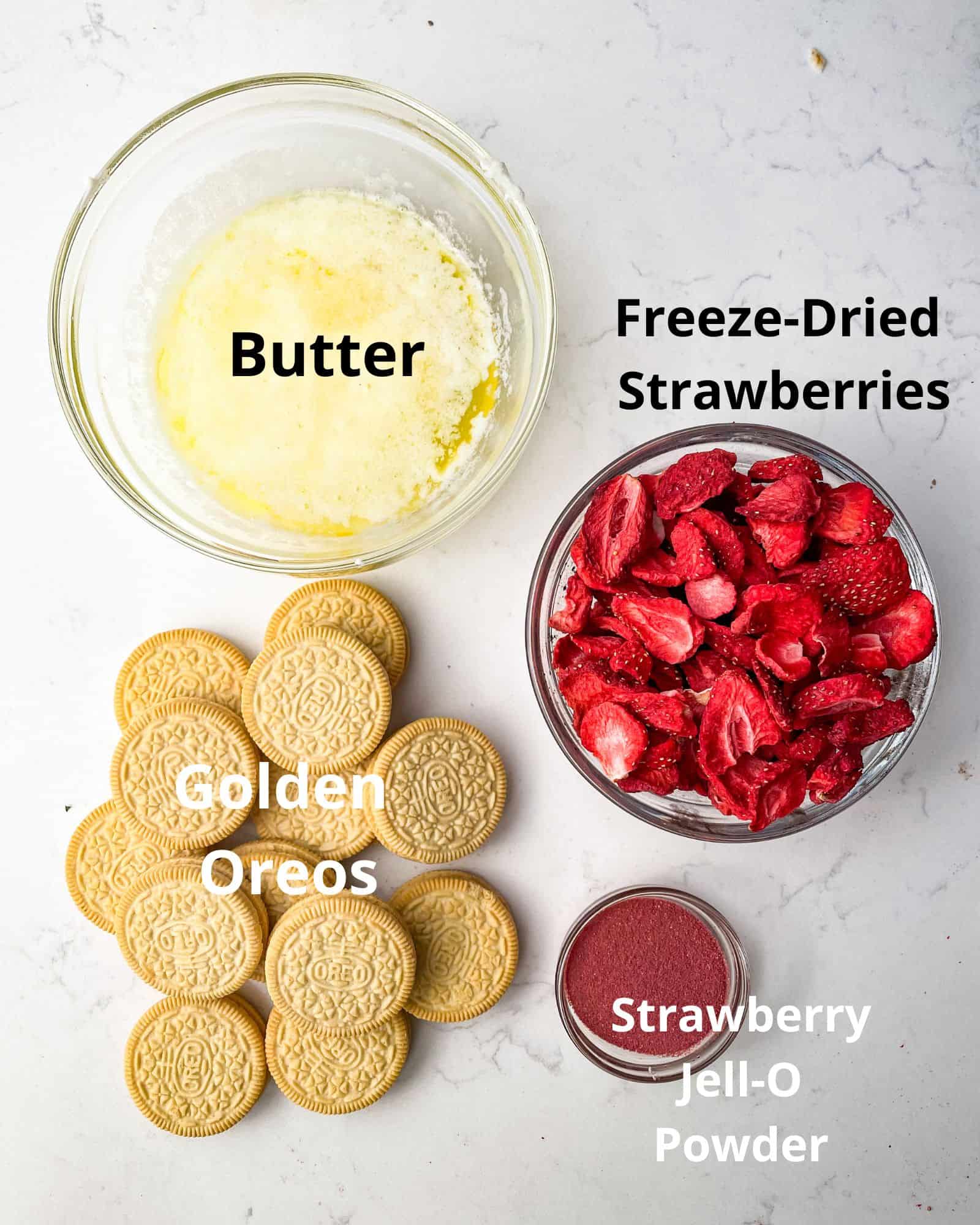 ingredients to make strawberry shortcake crumbles - golden oreos, freeze dried strawberries, melted butter, strawberry jello powder.