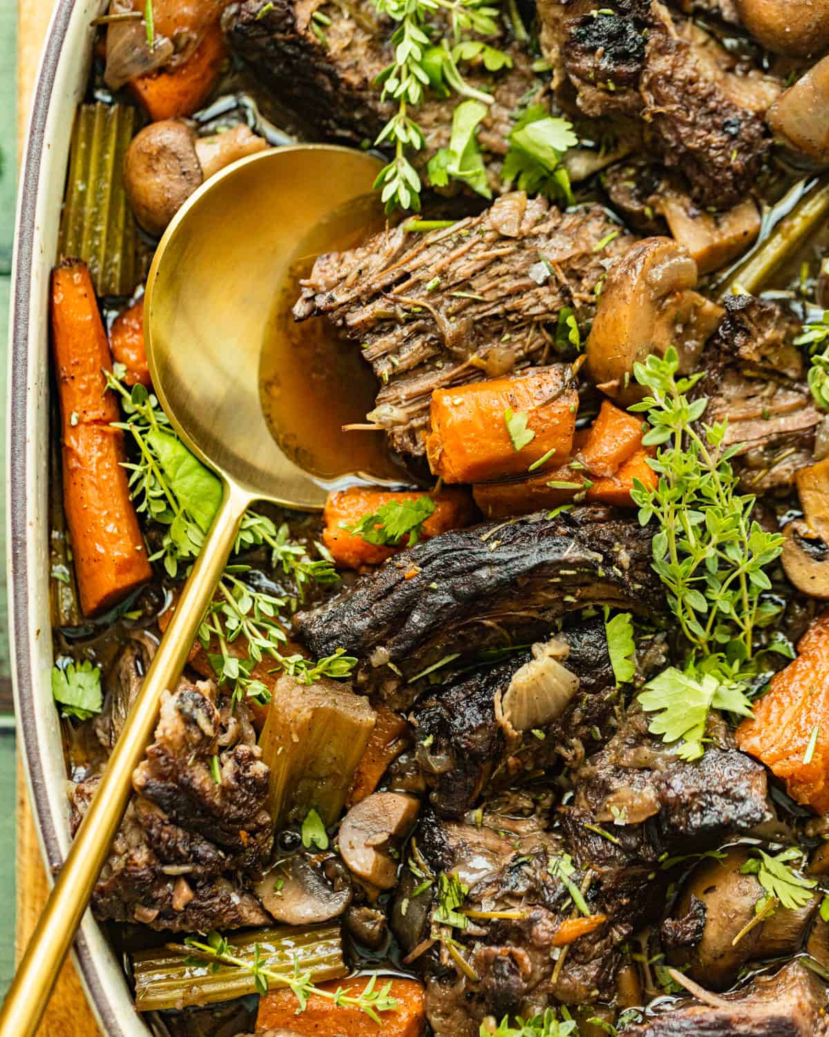 oven baked chuck roast in a serving dish.