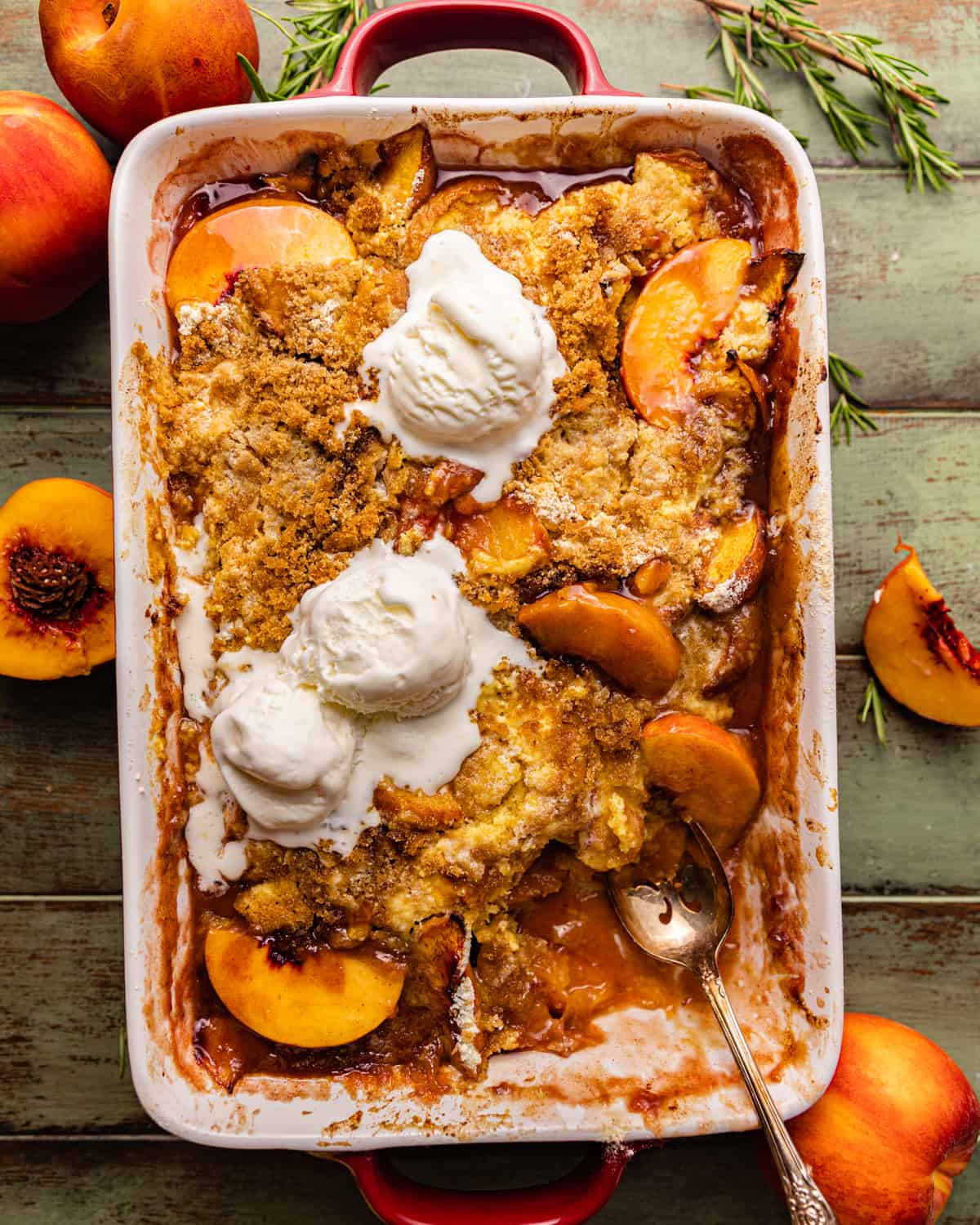 peach cobbler with cake mix in a 9x13 baking dish.