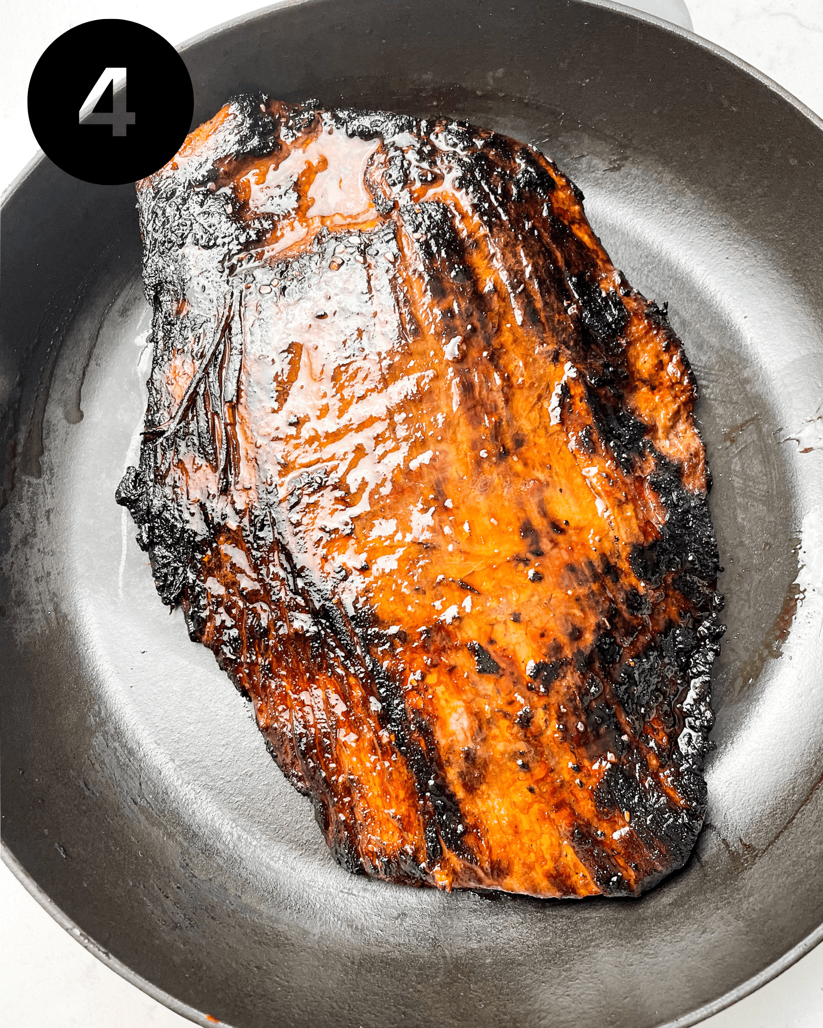 bavette steak in a cast iron pan.