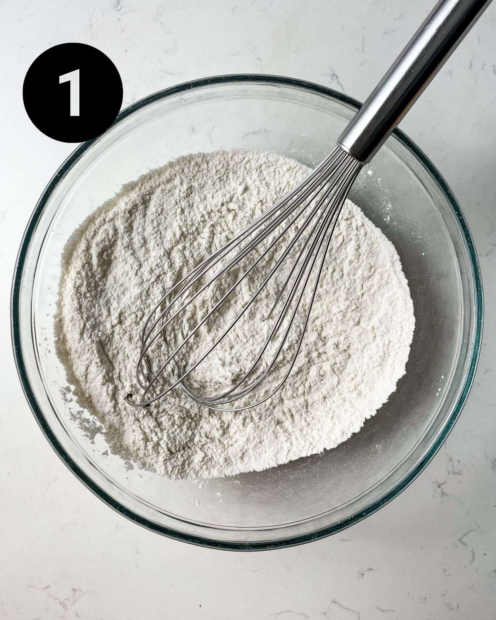 dry ingredients in a bowl with a whisk.