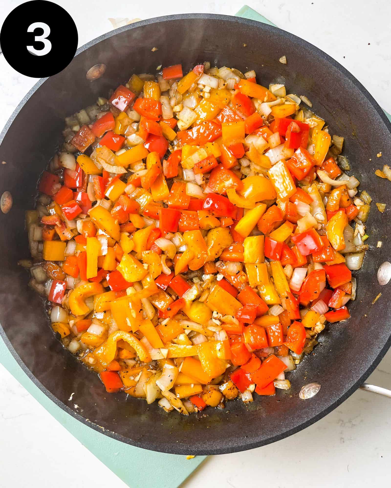 diced onions, bell peppers, and garlic in a skillet.