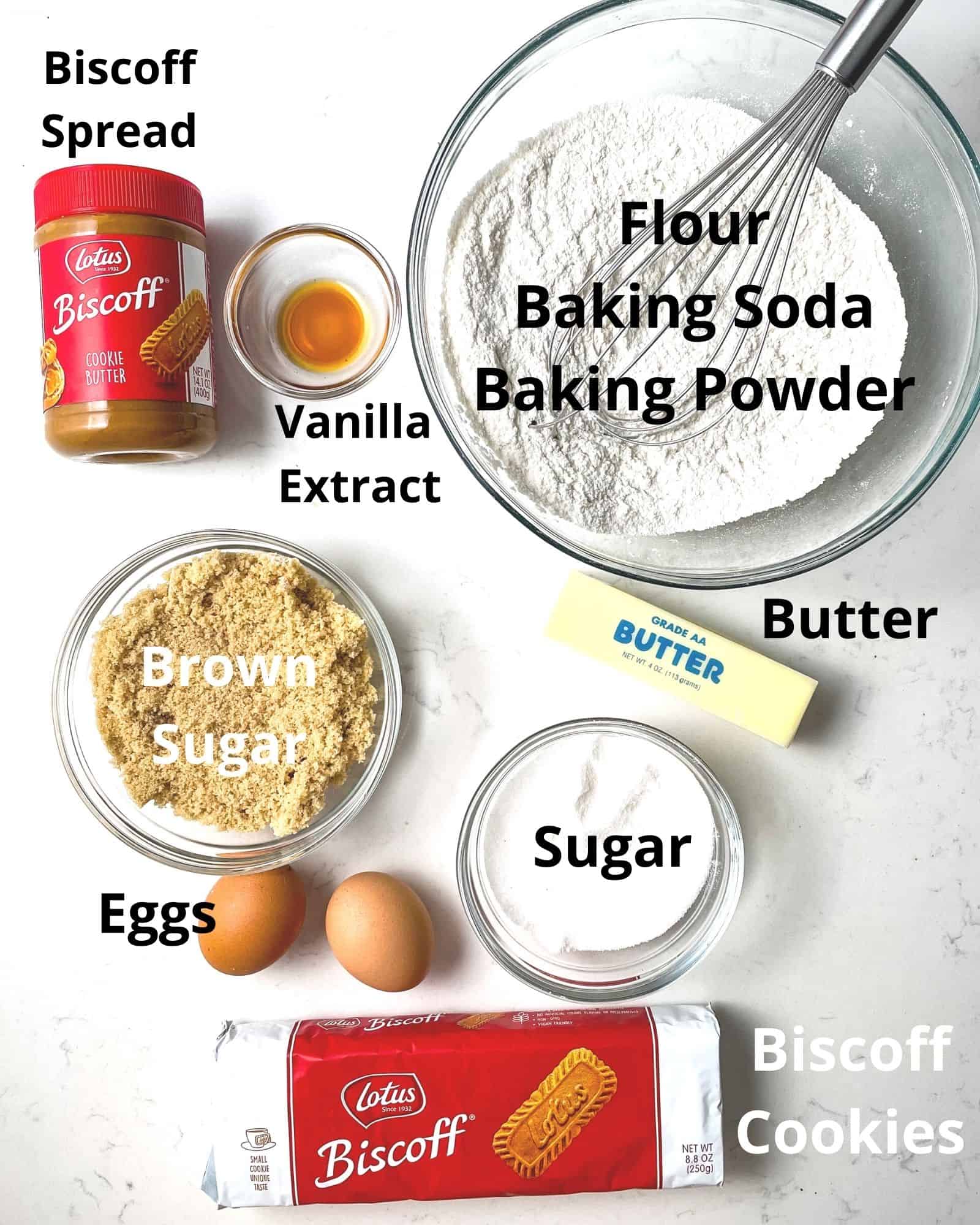 ingredients to make biscoff butter cookies - flour, baking soda, baking powder, biscoff spread, vanilla extract, brown sugar, sugar, eggs, butter, and biscoff cookies.