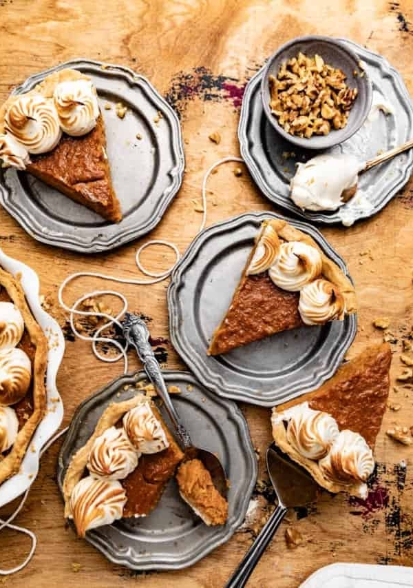 pieces of sweet potato pie slices on silver plates.