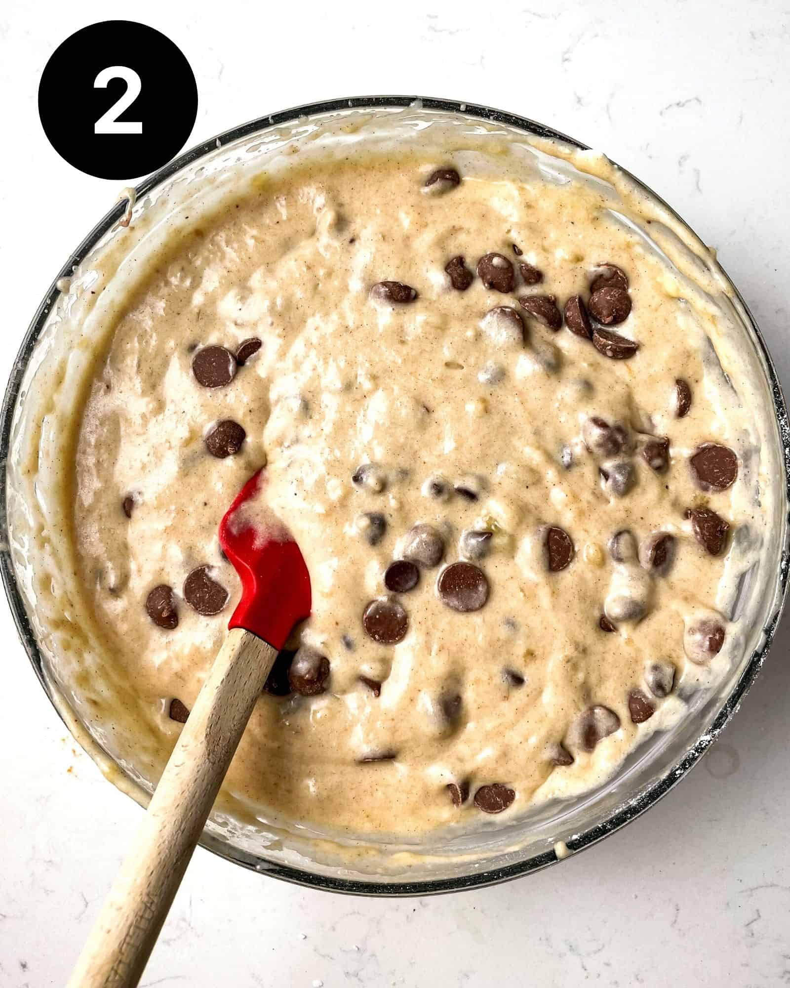 chocolate chip banana bread batter in a large mixing bowl.