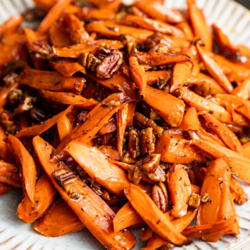 brown sugar honey glazed carrots on a plate.