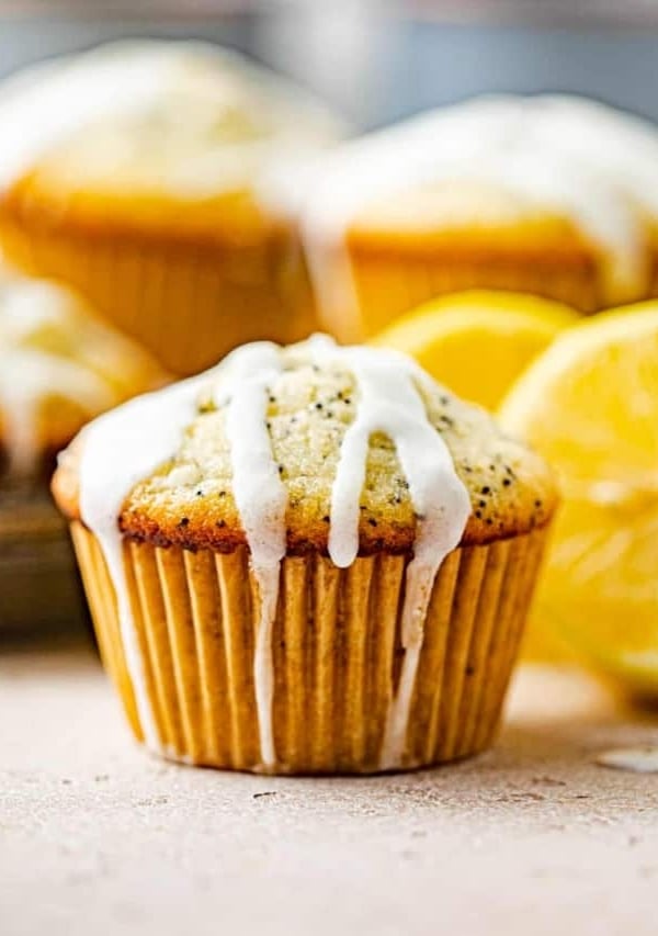 a lemon poppy seed muffin with lemon glaze on top.