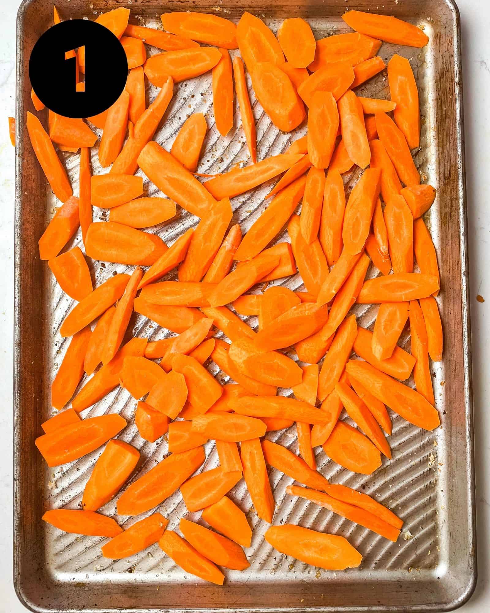 sliced carrots on a baking sheet.