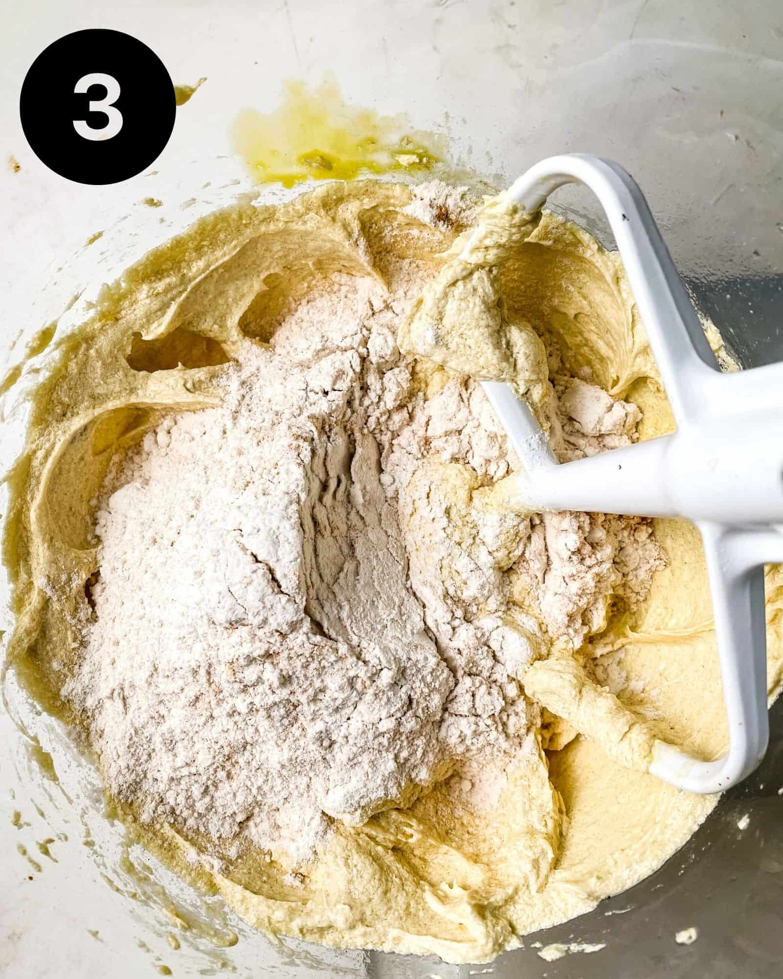 dry ingredients and wet ingredients combined in a mixing bowl.