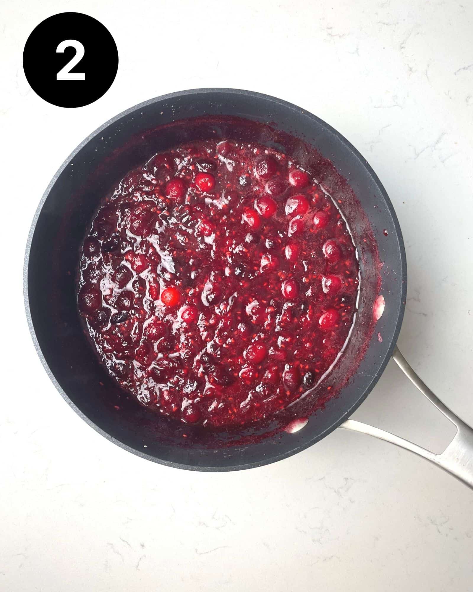 cranberry raspberry sauce in a saucepan.