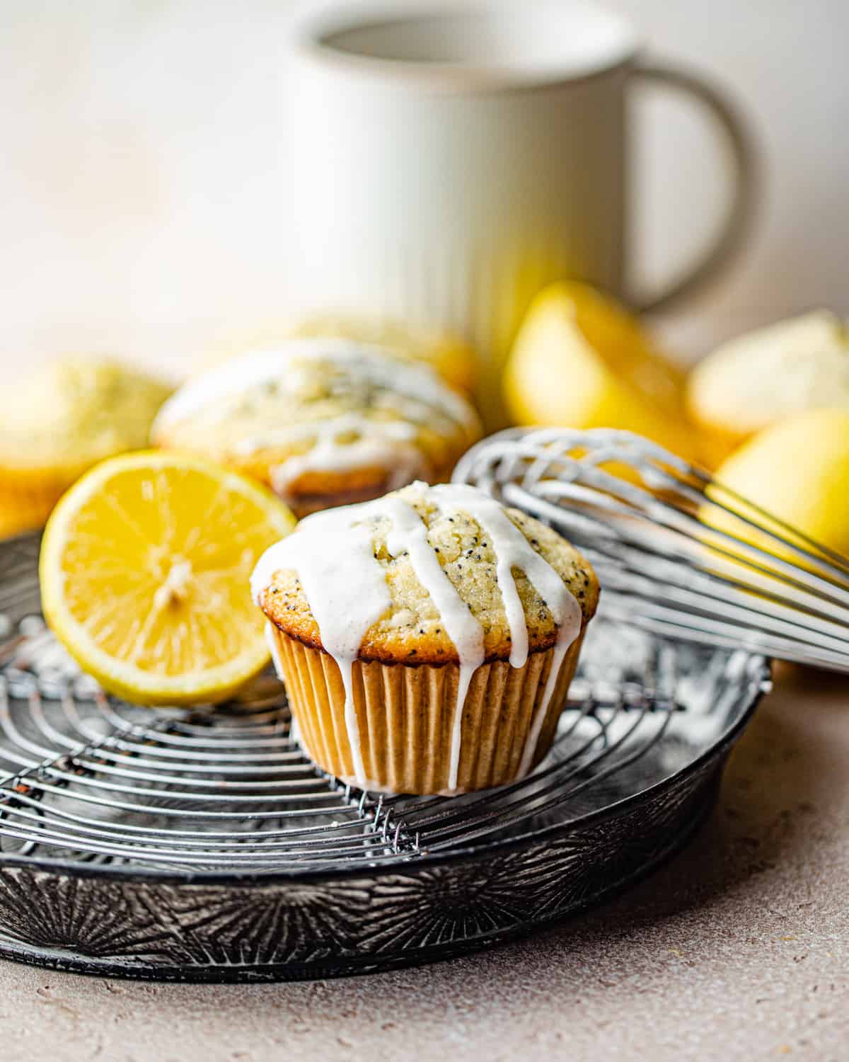 lemon poppy seed muffins on a wire rack.
