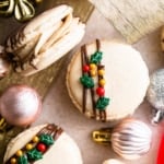 gingerbread macarons on a table with christmas ornaments.