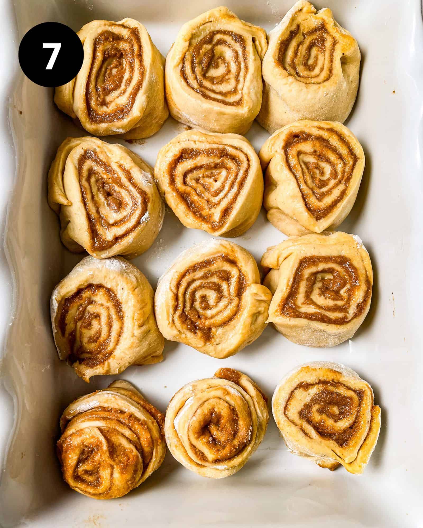 rolls cut into buns and placed in a baking dish.